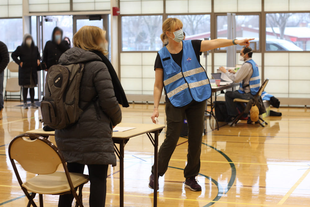 MRC Volunteer helping resident 